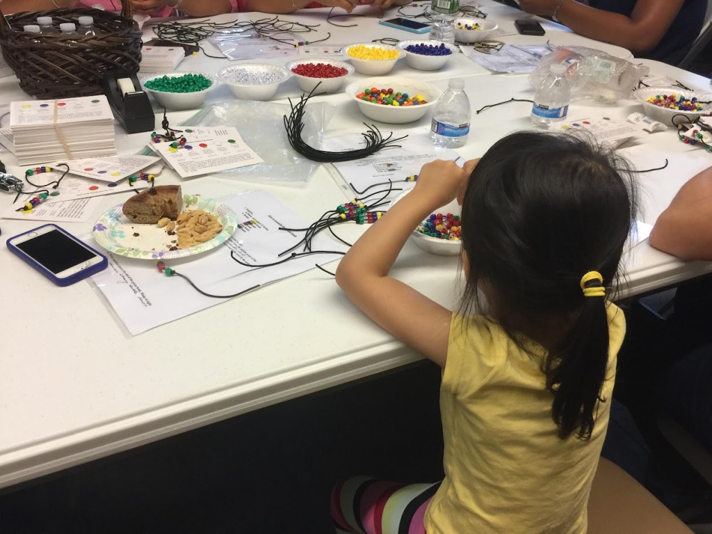 Snack, drink and beading activity for kid volunteers