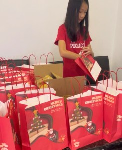 Packing goodie bags for a volunteering Christmas event