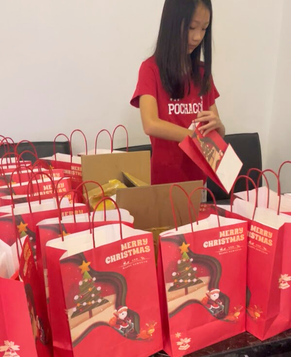 Packing goodie bags for a volunteering Christmas&nbsp;event